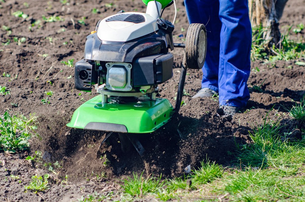 <a href="https://depositphotos.com/category/concepts.html">A man plows the land with a cultivator in a spring garden - depositphotos.com</a>
